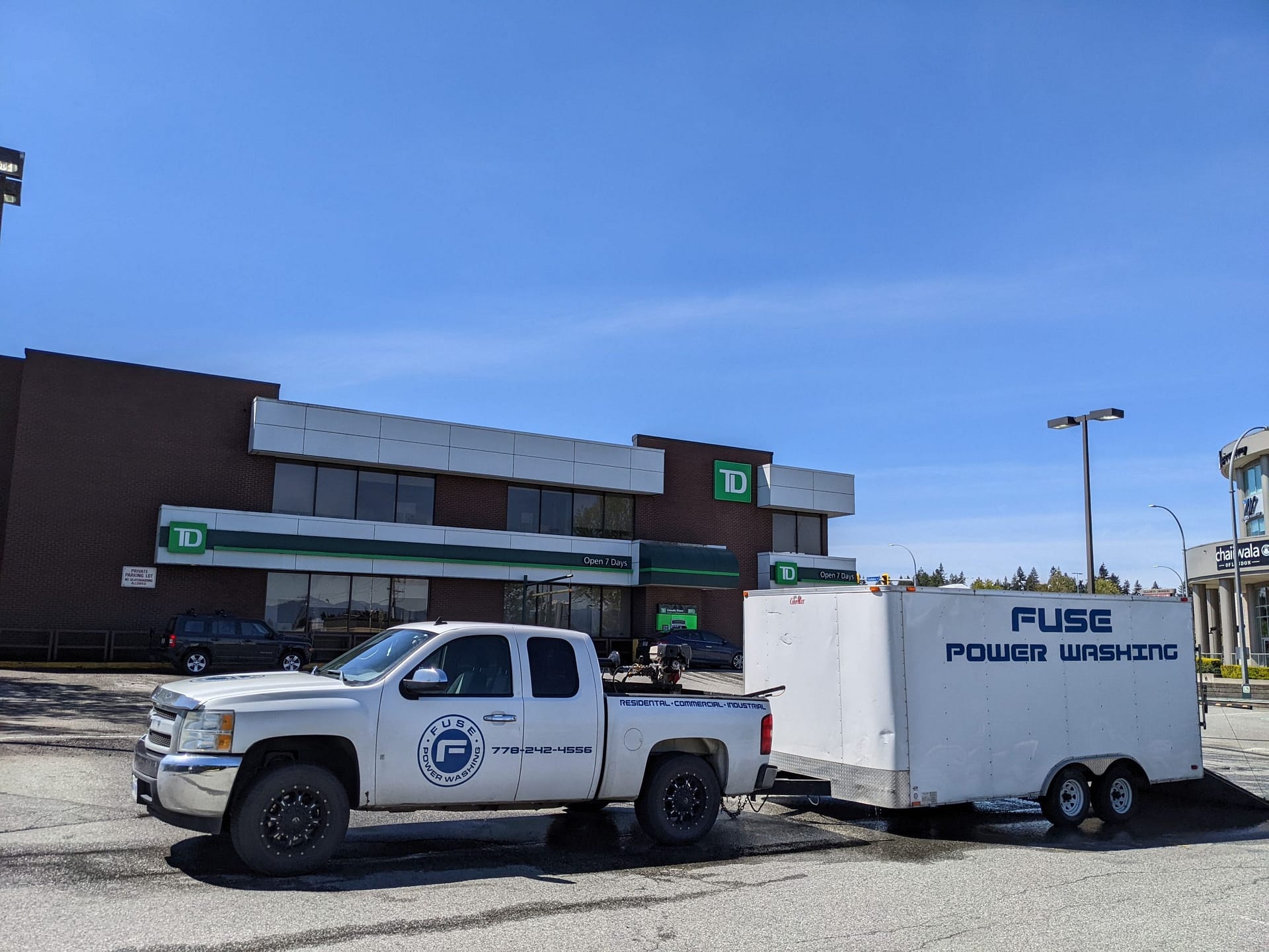 The truck fuse power washing parks at the parking lot of 7D.